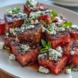Refreshing Grilled Watermelon Salad with Feta and Mint: Sweet, smoky watermelon meets tangy feta and bright mint leaves in a summer salad.  