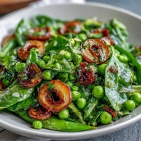 Bright Lemon Vinaigrette Spring Salad with crisp radishes and sweet peas in a zesty dressing.